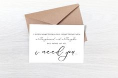 a card with the words i need you written in cursive writing on it