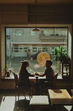 Couple sitting together at a coffee shop in Bern switzerland Photography In Coffee Shop, Coffee Shop Photo Shoot Couple, Couple At Coffee Shop Aesthetic, Vintage Coffee Photography, Couples Cafe Photo, Coffee Shop Cinematography, Valentines Coffee Photography, Cafe Shop Photography, Falling In Love At A Coffee Shop