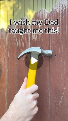 a person holding a hammer over a wooden door with the words i wish my dad taught me this