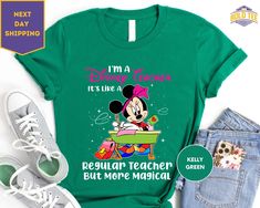 "Mickeyland Teacher Shirt, Teacher Minnie Mouse Shirts, I'm A Mickey Teacher Shirt, Regular Teacher But More Magical ORDERING: 1. Review all photos 2. Choose Size and Color from drop-down menu 3. If personalization box is available, add your text color 4. Add each shirt to cart one at a time 5. Click \"Add to Cart\" - you can go back to add more products 6. Click \"Proceed to Checkout\" 7. Add note to seller for any requests * We use several different brand shirts, all of them are premium qualit Minnie Mouse Shirts, Brand Shirts, Branded Shirts, Teacher Shirts, Text Color, Teacher Gifts, Bella Canvas, Minnie Mouse, Print On Demand