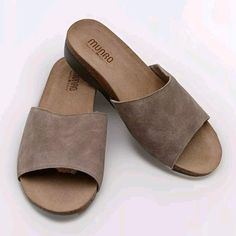 Elevate your comfort and style with these minimalist classic neutral sandals from MUNRO. The beige suede upper material paired with the slip-on closure and accent logo makes for a versatile and effortless look. These sandals are perfect for any occasion, whether it's a casual day out or a dressed-up event. Designed for women, these comfort slides are a part of the Comfort Slide product line and feature a US shoe size of 10. The tan color adds a touch of warmth to any outfit and the slide style makes them easy to wear and take off. These sandals are a must-have for any shoe collection and are sure to become a go-to pair for any outfit. Comfortable Everyday Suede Sandals, Suede Open Toe Sandals For Everyday, Comfortable Suede Sandals For Everyday Wear, Everyday Suede Open Toe Sandals, Neutral Sandals, Slingbacks, Tan Color, Shoe Collection, Women's Shoes Sandals