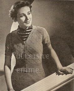 an old black and white photo of a woman holding a wooden board in her hands