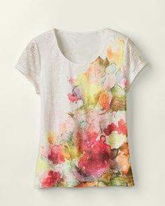 a t - shirt with flowers painted on it