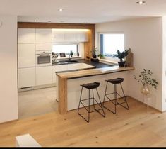 the kitchen is clean and ready to be used as a dining room or living room