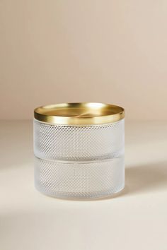 a white and gold ring on top of a table