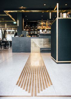 an image of a long wooden floor in a restaurant