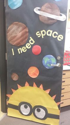 a door decorated with an image of the solar system, planets and a minion