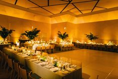 a large room with tables and chairs set up for an event