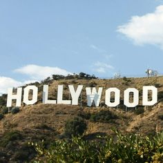 the hollywood sign is on top of a hill