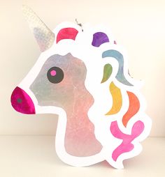 a close up of a paper cut out of a unicorn