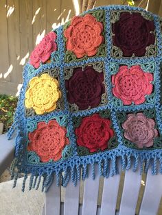 Bohemian Multicolor Granny Square Patterns, Fall Bohemian Poncho With Granny Squares, Cozy Multicolor Outerwear With Granny Square Detail, Floral Granny Square, Multicolor Granny Square Poncho One Size, Crocheted Rose, Bohemian Multicolor Granny Square Shawl, Ladies Poncho, Rose Garden