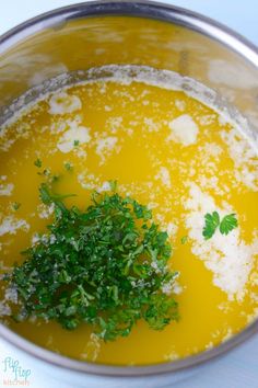 a bowl filled with soup and garnished with parsley