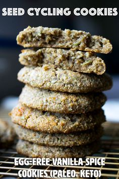 a stack of cookies sitting on top of a cooling rack with the words seed cycling cookies