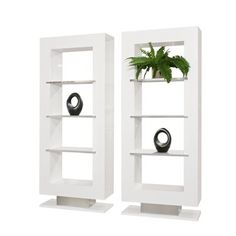 two white shelves with plants and vases on them in front of a white background