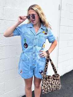 Get ready for summer with our Front Row Luxe Denim Romper! Made of lightwash denim, this funky and fun romper is perfect for those summer vibes. With assorted patches and a relaxed, edgy style, you'll be the coolest girl in the front row! ;) -Available in sizes Small-XL! -Assorted, funky patches throughout -- SO fun! -Lightwash denim -Button front closure -Oversized chest and side pockets -Oversized back pocket on right side -Collar detail -Adjustable waist -83% Cotton; 12% Polyester; 5% Rayon S Nice Rompers, Kimono Coat, Get Ready For Summer, Checker Print, Edgy Style, Denim Romper, Hair Accessories Jewelry, Moto Jacket, Edgy Fashion