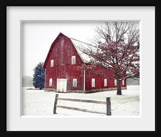 a red barn in the middle of winter