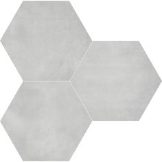 three hexagonal tiles are shown in grey and white colors, one is made out of cement