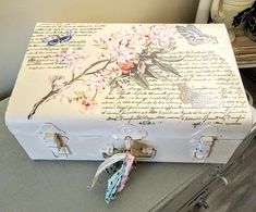 an old suitcase is decorated with flowers and writing