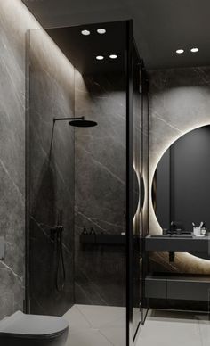 a modern bathroom with marble walls and flooring is shown in black and white colors