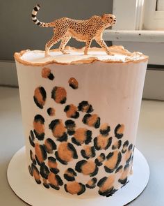 a cake with a cheetah on top