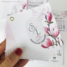 a person holding up some cards with flowers on them and the number one in spanish