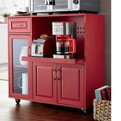 a red cabinet with a microwave and coffee maker on top