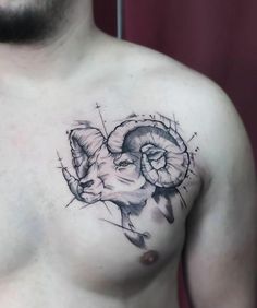 a man with a goat tattoo on his chest