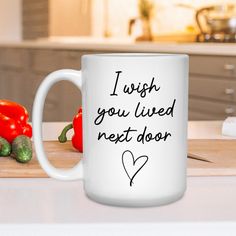 a white coffee mug with the words i wish you lived next door written on it