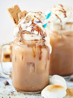 two glasses filled with hot chocolate and marshmallows