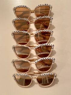 six pairs of sunglasses with pearls on them