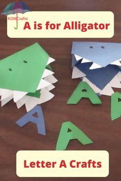 two origami dinosaurs with the letters a and a for alligator