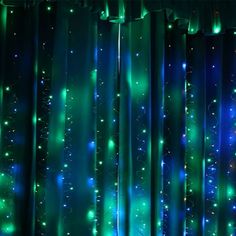 an image of a curtain with lights coming from the bottom and green on the top