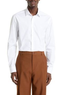 Embroidered with the iconic Equestrian Knight at the chest, this stretch-poplin button-up polishes your look while paying homage to the house's heritage. 30 1/2" length; 41" chest (size Medium) Front button closure Spread collar Long sleeves with button cuffs 96% cotton, 4% elastane Machine wash, line dry Imported Men's Designer Clothing Designer Fitted Button-up Shirt, Designer Fitted Shirt For Workwear, Designer Fitted Shirt With Button Cuffs, Fitted Single Breasted Shirt For Work, Fitted Single Breasted Work Shirt, Designer Fitted Collared Dress Shirt, Luxury Workwear Dress Shirt With Button Closure, Luxury Dress Shirt For Work, Luxury Workwear Dress Shirt