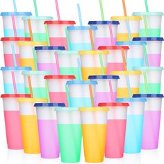 many different colored cups with straws in them