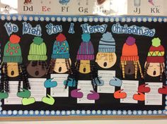 a bulletin board decorated with winter hats and music sheets for kids to play in the snow