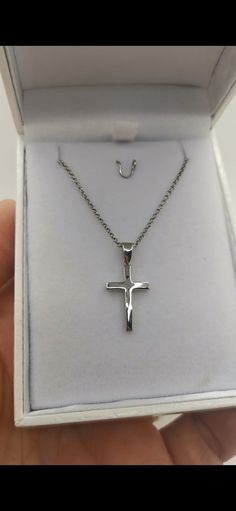 Men's Silver Cross 925. Plated for protection against tarnishing. Comes with a silver 925 plated chain. Immediately available and shipped in a gift box. An ideal cross for everyday wear that you will never part with. Choose a chain in two lengths: At 52 centimeters and at 55 centimeters Cross Dimensions: 2.5 x 1.2 x 0.2 cm. Weight (including the chain): 4g The necklase is crafted in our jewellery workshop and comes with the lifetime warranty Our jewellery made 100% in Greece Silver Cross Necklace For Father's Day Gift, Gift White Gold Cross Necklace In Stainless Steel, Silver Stainless Steel Cross Necklace For Gift, Silver Stainless Steel Cross Necklace As Gift, Polished Cross Jewelry As A Gift, Classic Silver Crucifix Jewelry, Classic White Gold Cross Necklace For Gift, Classic White Gold Cross Necklace Gift, Silver Crucifix Chain Jewelry Gift