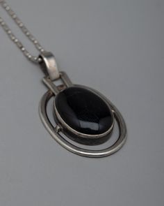 Silver Onyx Locket Disclaimer: Please note that the locket you've ordered does not include the chain/necklace. However, we have some special chain/necklace available to complement your locket perfectly. If you're interested in our chain/necklace options, please don't hesitate to send us a message for more details. Thank you for choosing us!About our locket Presenting our stunning oval-shaped Silver Onyx Locket, which has been painstakingly created on a pure silver body. A gorgeous black onyx sto Black Engraved Oval Pendant Jewelry, Black Sterling Silver Medallion Jewelry, Unique Black Oval Pendant Necklace, Black Metal Medallion Jewelry, Black Medallion Metal Jewelry, Black Sterling Silver Locket Necklace, Black Metal Necklace With Locket, Collectible Black Jewelry With Large Pendant, Black Round Pendant Necklace Collectible