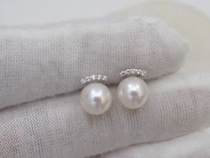 Material : Genuine Natural Freshwater Pearls with 18K Gold / White Gold Posts with Cubic Zirconia Quantity : One Pair Earrings Color : Natural White Pearls with 18K Gold/White Gold Posts Pearl Shape : Round Pearl with High Luster Pearl Size : 7mm approx. Lead Time & Shipping : We will ship your order in 1-2 business days to you once we received it. If we offer FREE DOMESTIC shipping, package will be shipped via USPS First Class mail on orders shipping within the U.S.. **Express Mail orders r Pearl Earring Studs, Pink Pearl Necklace, Bridal Pearl Necklace, Bridal Earrings Pearl, Cultured Pearl Necklace, Baroque Pearl Necklace, Pearl Bridal, Freshwater Pearls Earrings, Earring Studs