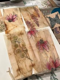 several pieces of paper with flowers painted on them