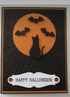 a halloween card with a cat and bats