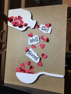 a handmade card with paper cut out of spoons and words that say get well soon