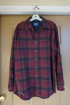 Pendleton button up shirt. Labeled as a size L.   Warm wool material.  Great condition -all buttons present -no holes!Measurements taken across front lying flat25.5" armpit to armpit31" length22" across shoulders25" arm length Casual Plaid Wool Shirt, Plaid Flannel Shirt With Snap Buttons, Long Sleeve Wool Plaid Flannel Shirt, Casual Wool Flannel Button-up Shirt, Winter Plaid Flannel Shirt With Buttons, Winter Plaid Flannel Shirt, Classic Plaid Wool Flannel Shirt, Classic Wool Plaid Flannel Shirt, Bathing Suit Dress