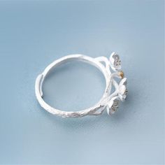 Limited Stock Available - Click "ADD TO CART" To Get Yours Now Gorgeous flower ring made of 925 sterling silver. This Plum Blossom Flower Ring Personality Fashion Trendy Women Ring from Arimonz could make you become more fresh and attractive. Very cute and elegant fits your finger well. You can wear it to parties or daily use, will not fade even if you wear it for a long time. Specifications: Metals Type: Silver Metal Stamp: 925,Sterling Package Includes: 1*Plum Blossom Flower Ring Personality F Adjustable Sterling Silver Promise Flower Ring, White Gold Open Flower Ring, Silver Nature-inspired Open Flower Ring, Nature-inspired Silver Open Flower Ring, Adjustable Silver Flower Ring In Fine Jewelry Style, Adjustable White Gold Open Flower Ring, Adjustable White Gold Flower Open Ring, Adjustable Open Flower Ring In White Gold, Adjustable Silver Flower Ring Fine Jewelry