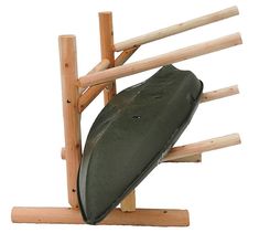 a canoe on a wooden stand with two paddles attached to it