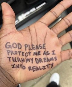 a hand with writing on it that says god please protect me as i turn my arms into reality