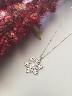 Handmade Snowflake silver necklace. The carefully handmade product is a very elegant gift for your loved ones. This prdoduct: - Chain 45 cm/17 inc - Snowflake 3 cm It is handmade and has a very beautiful design. The shine is very beautiful due to the stone cuts. The product is very suitable for everyday use. The back of the product is polished, does not snag, is an eye-catching and very popular product. Elegant Winter Jewelry As Gift, Silver Snowflake Jewelry For Christmas, Silver Snowflake Jewelry For Holidays, Holiday Silver Snowflake Jewelry, White Gold Snowflake Necklace For Anniversary, Elegant Winter Holiday Jewelry, Holiday Sterling Silver Necklaces, Silver Snowflake Necklace For Anniversary, Sterling Silver Snowflake Jewelry For Winter