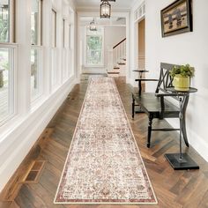 the hallway is clean and ready to be used as a dining room or living room