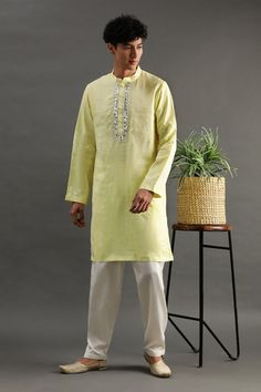 Lime linen kurta with gota hand embroidered placket and side pockets. Comes with white pyjama.
Components: 2
Pattern: Hand embroidered
Type Of Work: Gota
Neckline: Band collar
Sleeve Type: Full
Fabric: Linen
Color: Yellow
Other Details: 
Closure : Front buttons
Occasion: Mehendi and Puja,Sangeet - Aza Fashions Traditional Long Sleeve Linen Kurta, Festive Traditional Kurta With Relaxed Fit, Traditional Relaxed Fit Kurta For Festive Occasions, Linen Straight Kurta With Resham Embroidery, Straight Linen Kurta With Resham Embroidery, Linen Kurta With Resham Embroidery, Festive Linen Kurta For Eid, Traditional Linen Kurta With Resham Embroidery, Long Sleeve Linen Kurta With Chikankari Embroidery