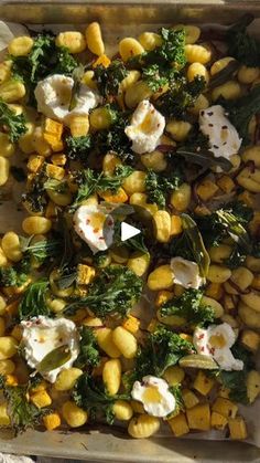 a tray filled with corn and other vegetables