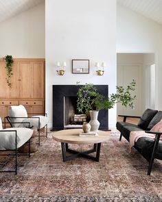 a living room filled with furniture and a fire place